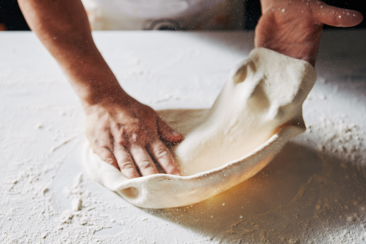 Rolling Dough To Make Pizza